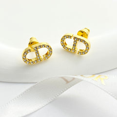 CD 26S Crystal Logo Stud Earrings In Gold Metal 633106